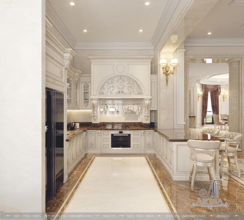 Không gian bếp phong cách tân cổ điển trang nhã với gam màu trắng chủ đạo được trang trí hoa văn tinh tế