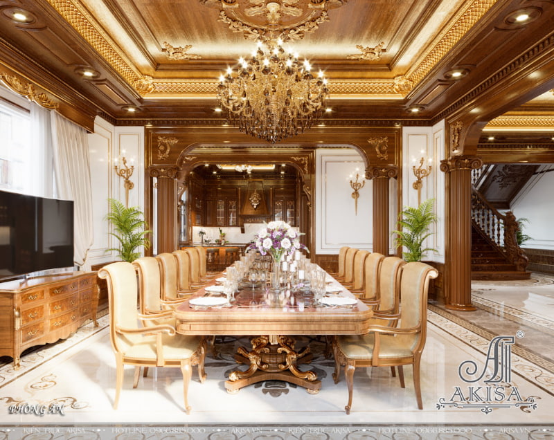 Phòng bếp ăn gây ấn tượng với bộ bàn ghế gỗ tự nhiên, trần giật cấp, hệ cột và các chi tiết trang trí phào chỉ mạ vàng tinh xảo 