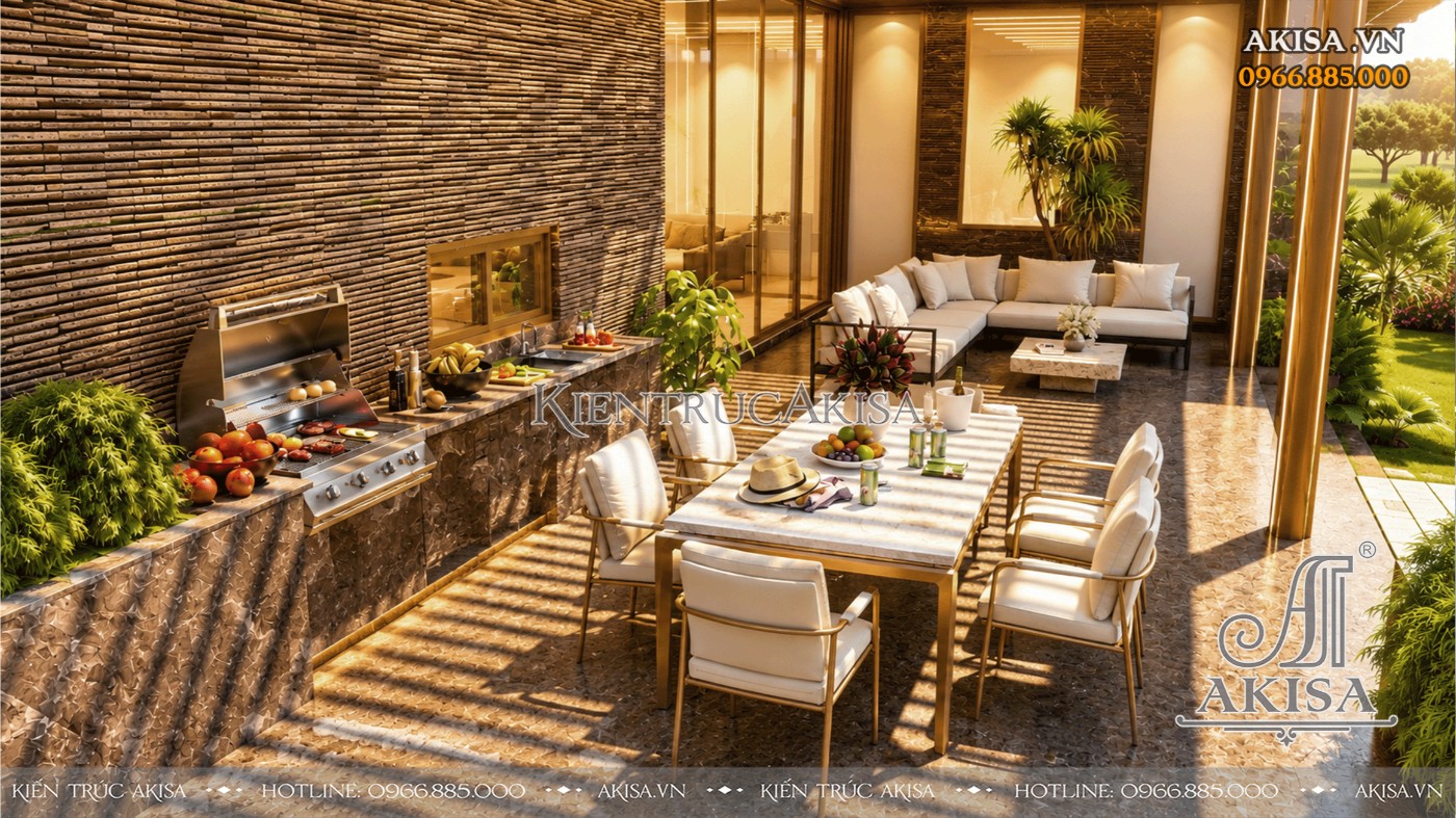 Khu BBQ ngoài trời kết hợp bàn ăn và sofa thư giãn trong biệt thự 1 tầng có bể bơi.
