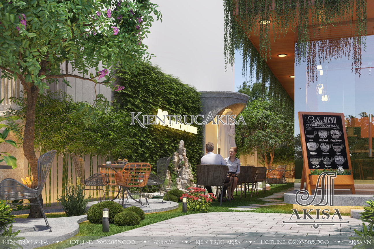 Cảnh quan sân vườn được bố trí đẹp làm sống động không gian bên ngoài cửa hàng cafe hiện đại
