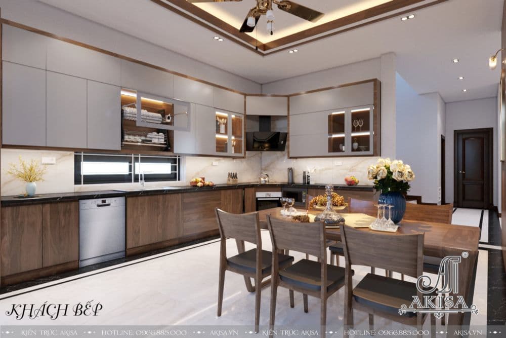 Vẻ đẹp nhẹ nhàng, tinh tế của phòng bếp trắng sang trọng kết hợp với các đồ nội thất bằng gỗ, đèn âm trần thiết kế đơn giản