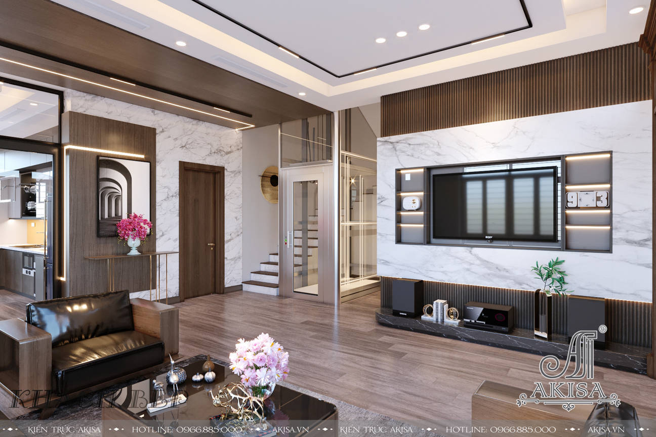 Phòng khách thiết kế đơn giản với tông màu trắng làm chủ đạo kết hợp màu nâu gỗ của các vật dụng nội thất tạo vẻ đẹp nhẹ nhàng, sang trọng 