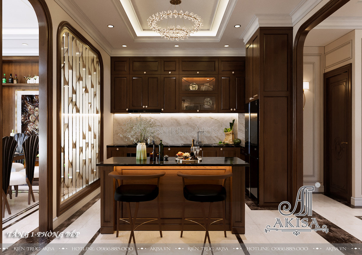 Khu vực bếp được thiết kế riêng biệt với bộ tủ bếp và bàn soạn bằng gỗ nâu trầm sang trọng, vách ngăn bằng kim loại vừa có tính thẩm mỹ cao vừa tạo sự kín đáo cần thiết