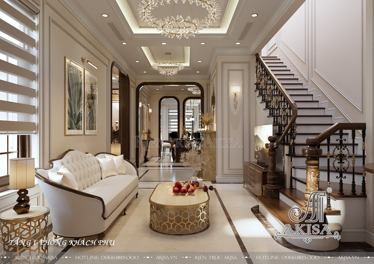 Phòng khách phụ với tông màu trắng chủ đạo được bố trí ở sảnh thang tầng 1, bộ sofa dài êm ái cùng hệ thống đèn rực rỡ mang đến không gian sinh hoạt chung thoải mái và tinh tế.